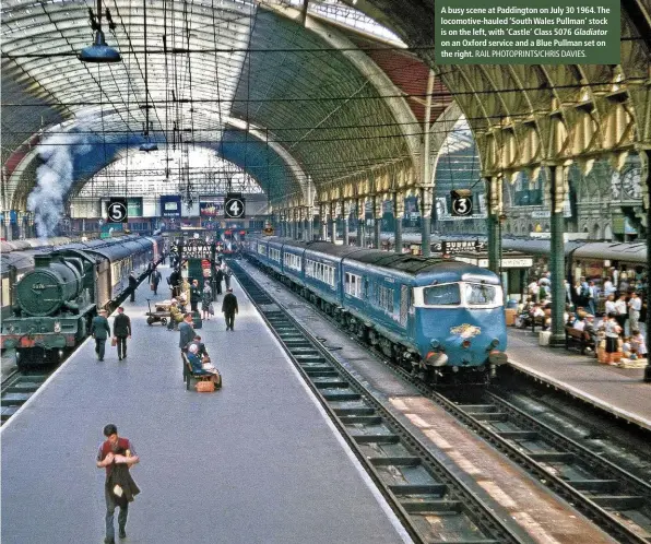  ?? RAIL PHOTOPRINT­S/CHRIS DAVIES. ?? A busy scene at Paddington on July 30 1964. The locomotive-hauled ‘South Wales Pullman’ stock is on the left, with ‘Castle’ Class 5076 Gladiator on an Oxford service and a Blue Pullman set on the right.