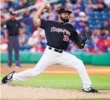  ?? ADOLPHE PIERRE-LOUIS/JOURNAL ?? Rico Garcia fires to the plate during Saturday’s game against Round Rock. Garcia pitched six innings and earned his first win with the Isotopes.