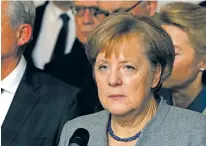  ?? MICHAEL SOHN/THE ASSOCIATED PRESS ?? German Chancellor Angela Merkel addresses the media Monday during a news conference about the results of talks on a coalition of parties in Berlin.