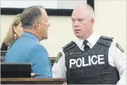  ?? BOB TYMCZYSZYN THE ST. CATHARINES STANDARD ?? Niagara Regional Police Chief Bryan MacCulloch speaks with Mayor Walter Sendzik at Monday’s city council meeting.