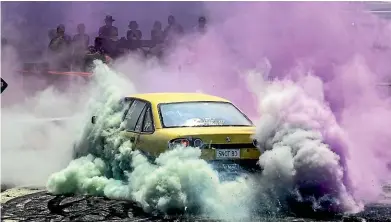  ?? IAIN MCGREGOR/STUFF ?? Mark Woodthorpe in a VS at the burnout pad at Muscle Car Madness in Rangiora.