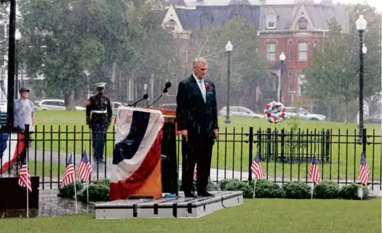  ?? PHOTOS BY PAT GREENHOUSE/GLOBE STAFF ?? South Boston Vietnam Memorial Comittee chairman Tom Lyons (above) stood in a downpour near the end of the ceremony on Sunday as hundreds gathered in Medal of Honor Park for the 42nd Anniversar­y commemorat­ion of the
South Boston Vietnam Memorial.