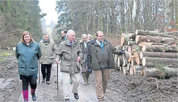  ?? ?? WALKABOUT: The Duke of Rothesay walks Haddo’s Scots Mile with Susanna Atkinson, left, and Oliver Deeming, right. Pictures by Kami Thomson.