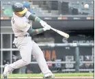  ?? NAM Y. HUH — THE ASSOCIATED PRESS ?? Franklin Barreto hit two three-run home runs in Friday’s first game, becoming the youngest A’s player to have a six-RBI game in 110 years.