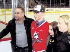  ?? BERND FRANKE/POSTMEDIA NEWS ?? Niagara IceDogs first-round pick Philip Tomasino poses with father Manny, sister Isabella, 11, and mother Shannon on OHL draft day.