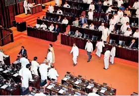  ??  ?? And away they go: The moment the 16 MPs crossed over from the govt. side to the opposition. Pic by Indika Handuwala