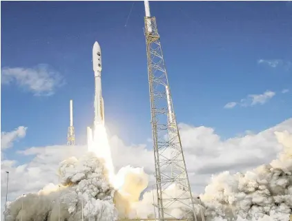  ?? PHOTO: REUTERS ?? In the beginning . . . The Atlas V rocket carrying New Horizons blasts off from Cape Canaveral on January 19, 2006.