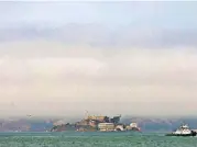  ?? [AP PHOTO] ?? Hazy air surrounds Alcatraz Island Wednesday in San Francisco Bay. The air quality has hit unhealthy levels in cities miles away as California’s largest wildfire ever burns to the north.