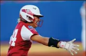  ?? Brian Bahr / Getty Images ?? Jayda Coleman of the Oklahoma Sooners celebrates as she rounds third base to score on a three-run home run by Jocelyn Alo against the Texas Longhorns in the first inning during Wednesday’s game