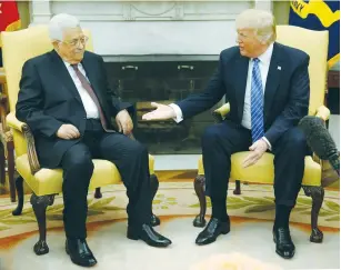  ?? (Jonathan Ernst/Reuters) ?? LET’S MAKE A DEAL. US President Donald Trump welcomes PA President Mahmoud Abbas at the White House in Washington yesterday.