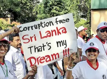  ?? ?? An anti-corruption march to mark World Anti-corruption Day by civil society organizati­ons.