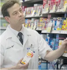  ?? GERRY KAHRMANN/PNG ?? London Drugs Pharmacist Gianni Del Negro says there is little help for kids under six who are suffering from colds as the federal government has advised not to give them any over-the-counter medicine.