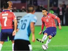  ?? AFP ?? Sidelined Chile defender Gonzalo Jara in action against Uruguay during the quarter-final. Jara’s ban for ‘unsporting behaviour’ during the match was cut to two games but he will miss the final.