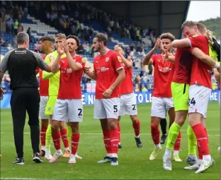  ?? ?? BIG DAY: Barnsley’s fans and players celebrate their 2-0 victory at Sheffield Wednesday on Saturday. Pictures: Keith Turner.