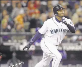  ?? John FrosChAuer/AssoCiAteD press Files ?? Ken Griffey Jr. (above hitting a solo home run for the seattle mariners) hit 630 homers, sixth all-time, and drove in 1,836 runs. he’ll be inducted into the Baseball hall of Fame today.