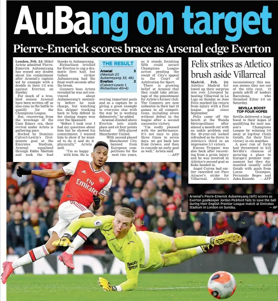  ?? — AP ?? Arsenal’s Pierre-Emerick Aubameyang (left) scores as Everton goalkeeper Jordan Pickford fails to save the ball during their English Premier League match at Emirates Stadium in London on Sunday.