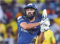  ?? AFP ?? Mumbai Indians captain Rohit Sharma sends one over the ropes during the match against Chennai Super Kings.