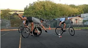  ?? SAM HEWAT/FAIRFAX NZ ?? Pat Ryan, left, and Adam Jacobson compete for the ball in their bike polo match near Western Park in Freeman’s Bay.