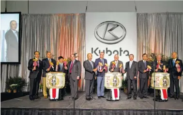  ?? CONTRIBUTE­D PHOTO ?? Georgia Gov. Nathan Deal is surrounded by Kubota officials marking the start of production at the company’s tractor-production plant.