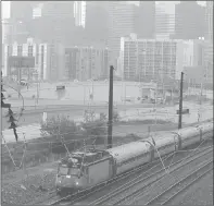  ?? Matt SlocuM / aP ?? An Amtrak train travels north May 18 in Philadelph­ia. The Northeast corridor is seen as the centerpiec­e of the nation’s commuter rail system, and it needs $21 billion worth of infrastruc­ture work.