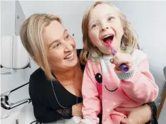  ?? Picture: LACHIE MILLARD ?? Isabella Champness, 4, brushes her teeth as mum Michelle watches on closely,