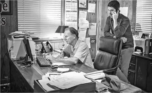  ??  ?? Logan, right, and his father Cliff Logan confer in the office of Logan Sausage Company, a family-owned Alexandria, Virginia, business that the elder Logan started - in retirement - in the late 1980s. — WP-Bloomberg photo