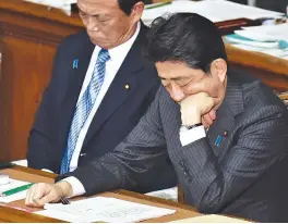  ??  ?? JAPAN’S Prime Minister Shinzo Abe (R) and Finance Minister Taro Aso (L) attend the House of Representa­tives plenary session at the Diet in Tokyo on Jan. 23.