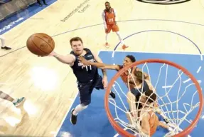  ?? AGENCE FRANCE PRESSE* ?? Luka Doncic #77 of the Dallas Mavericks shoots the ball during the game against the Phoenix Suns during Game 4 of the 2022 NBA Playoffs Western Conference Semifinals at the American Airlines Center in Dallas, Texas.