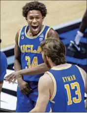  ?? Robert Franklin Associated Press ?? DAVID SINGLETON, top, Jake Kyman and teammates celebrated their win well into the morning.