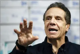  ?? JOHN MINCHILLO — THE ASSOCIATED PRESS ?? New York Gov. Andrew Cuomo speaks during a news conference against a backdrop of medical supplies March 24at the Jacob Javits Center that will house a temporary hospital in response to the COVID-19 outbreak