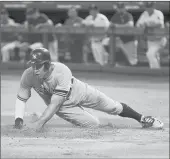  ?? BRANDON WADE/AP ?? Aaron Judge slides into home on a sacrifice fly from Brett Gardner during the Yankees’ loss to the Rangers.