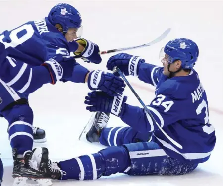  ?? RENÉ JOHNSTON/TORONTO STAR ?? Auston Matthews, right, and William Nylander celebrate a second-period goal before it was disallowed because Matthews made contact with Colorado goalie Jonathan Bernier. Matthews scored again on the next shift, but the Leafs lost 4-2. More coverage on S2.