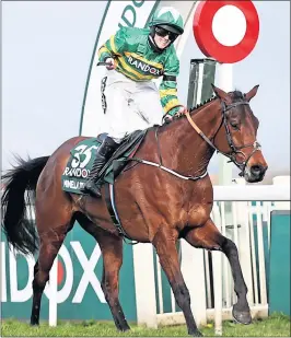  ??  ?? Racheal Blackmore crosses the line on Minella Times to become the first female jockey to win the Randox Grand National