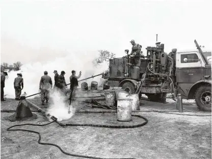  ?? Courtesy Photo / Halliburto­n Company ?? This decades-old photos shows a Halliburto­n crew working on a remote oil well. Founded in 1919, the Houston oil field service company is celebratin­g its 100th anniversar­y in 2019.