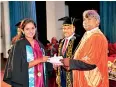  ?? ?? Graduatesh­ip In Chemistry student receiving her award.