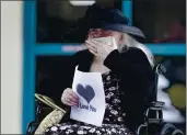  ?? WILFREDO LEE — THE ASSOCIATED PRESS ?? Margaret Choinacki, 87, blows kisses to a friend during a recent drive-by visit at her nursing home in Miami.