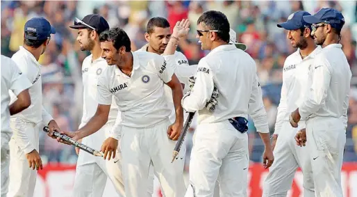  ?? PTI ?? Indian players celebrate victory over West Indies in the first Test at Eden Garden in Kolkata on Friday. —