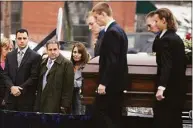  ?? Jim Michaud / Associated Press ?? In this Dec. 30, 2015 photo, Richard Dabate, left, watches the casket bearing his late wife Connie Dabate being carried during her funeral outside St. Bernard Roman Catholic Church in Vernon.