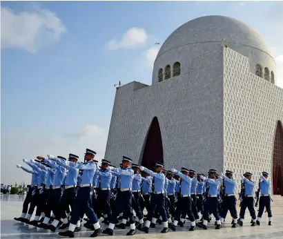  ?? AFP ?? Pakistan Air Force cadets march next to the mausoleum of the country’s founder Mohammed Ali Jinnah to mark the country’s Defence Day in Karachi on Wednesday. —