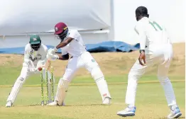  ?? PHOTO BY LENNOX ALDRED ?? West Indies Academy batsman Joshua Dorne plays a square cut during his breezy innings of 36 against the Jamaica Scorpions in first-day action of the West Indies Championsh­ip’s fourth round at Sabina Park yesterday. Wicketkeep­er Romaine Morris (left) and bowler Peat Salmon look on.