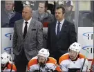  ?? GENE J. PUSKAR — THE ASSOCIATED PRESS ?? Flyers coach Alain Vigneault, right, watching an Oct. 29game with assistant coach Michel Therrien, has retreated to Canada to patiently wait out the coronaviru­s pandemic, optimistic that his team will be ready when and if the season restarts.