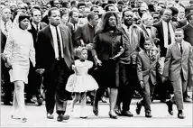 ?? NEW YORK TIMES FILE ?? The funeral for Martin Luther King Jr. on April 9, 1968, saw thousands of mourners follow King’s casket through Atlanta — drawn on mule-driven wagon — from Ebenezer Baptist Church to Morehouse College. On the march were MLK’s oldest child, Yolanda King (from left); his brother, A.D. King; youngest child, Bernice King; widow, Coretta Scott King; civil rights leader Ralph David Abernathy; and MLK’s sons, Dexter King and Martin Luther King III.