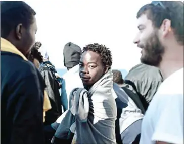  ?? RANEE/AFP KENNY KARPOV/SOS MEDITER- ?? Migrants onboard the as the rescue ship is on its way to Spain on Saturday.