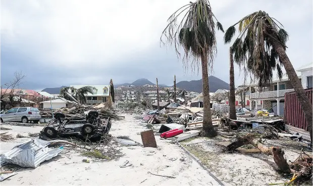  ?? LIONEL CHAMOISEAU / AFP / GETTY IMAGES ?? The French-Dutch nation of St. Martin was one of the hardest-hit by Hurricane Irma, as it ripped through several Caribbean islands this week.