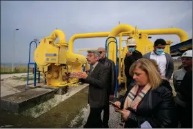  ?? (AP/Hassan Ammar) ?? Lebanese Energy Minister Walid Fayad (left) tours the Biddawi oil facility Tuesday in the northern city of Tripoli.