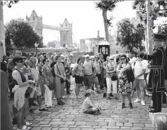  ?? MATT DUNHAM / ASSOCIATED PRESS ?? Visitors on Monday enjoy the first tour of the Tower of London in 16 months as England sheds its final coronaviru­s restrictio­ns.