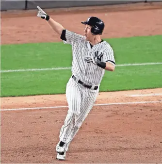  ?? ADAM HUNGER, USA TODAY SPORTS ?? Todd Frazier’s three-run homer gave the Yankees the early lead Monday against the Yankees in Game 3 of the American League Championsh­ip Series. The game ended too late for this edition. For game coverage, check out mlb.usatoday.com