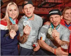  ?? Foto: Kneffel/dpa ?? Gemeinsam mit Skistar Lindsey Vonn feierten die Eishockeys­pieler Patrick Reimer (rechts) und David Wolf ihre Silbermeda­ille in Korea.