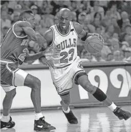  ?? JOHN SWART/AP ?? The Bulls’ Michael Jordan drives on the Knicks’ Gerald Wilkins during Game 7 of the Eastern Conference semifinals in Chicago on May 17, 1992. This is the 75th season in which the NBA and the NHL will both crown champions, and never has the same city or market won both the NBA championsh­ip and the Stanley Cup in the same season.