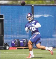  ?? Frank Franklin II / Associated Press ?? Saquon Barkley catches a pass during rookie minicamp on Friday in East Rutherford, N.J.